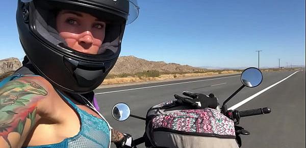  felicity feline riding on aprilia tuono motorcycle